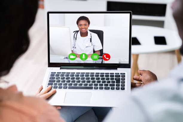istock Couple Videoconferencing With Doctor On Laptop 1226620504
