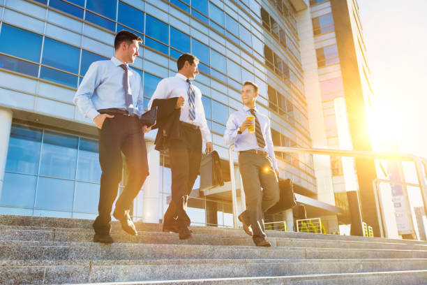 istock Mature businessmen talking while walking downstairs against office building after work 1226624906