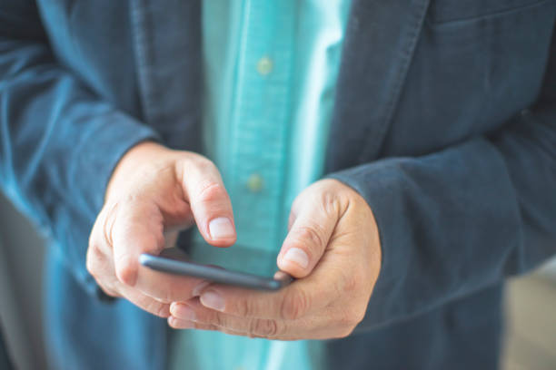 istock Close up of a man using smartphone 1226626263