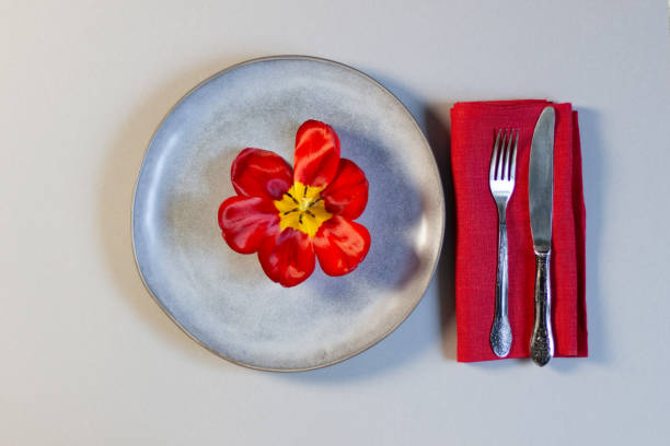 istock Holiday plate decoration with red tulips 1226626559