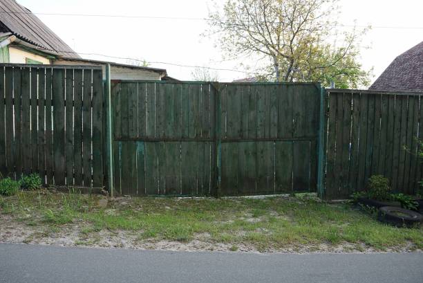 istock closed old wooden green gate 1226627754