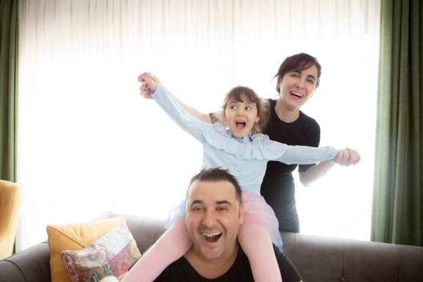 istock Happy family having fun time at home 1226628663