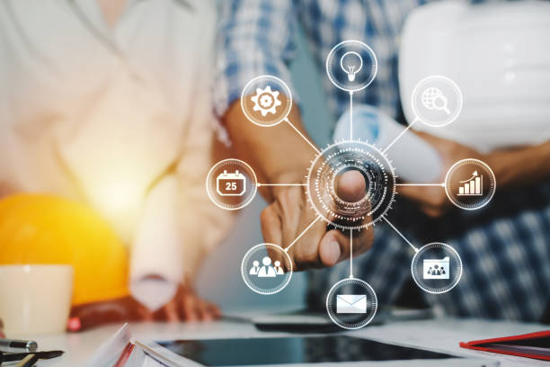 istock hands of group engineer and architect working on blueprint and safety helmet with virtual digital icon in meeting room at construction site office, contractor, engineering and construction concept 1226628876