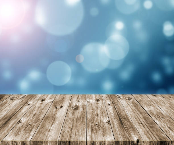 istock Old brown wooden plank with abstract blurred bokeh light backgrounds 1226632016
