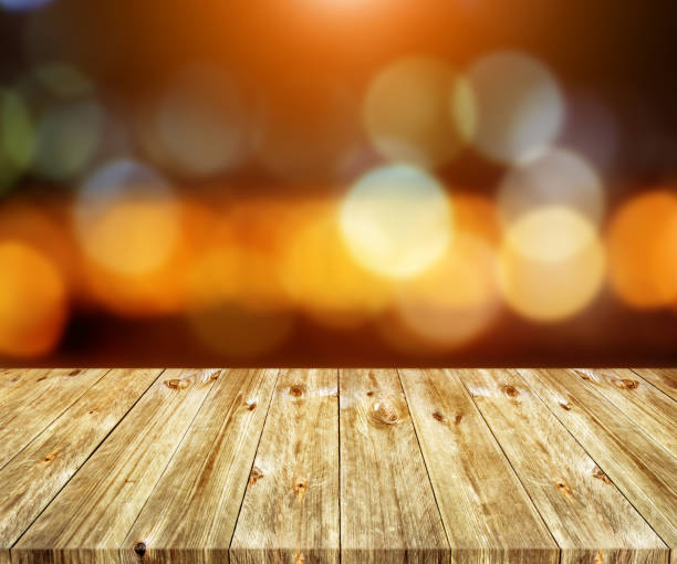 istock Old brown wooden plank with abstract blurred bokeh light backgrounds 1226632029