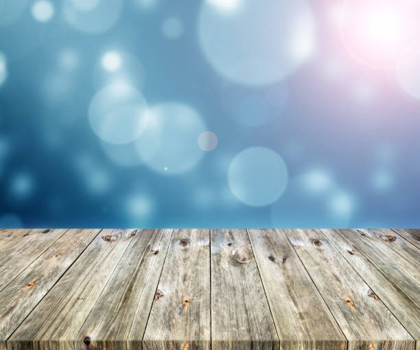 istock Old brown wooden plank with abstract blurred bokeh light backgrounds 1226632045