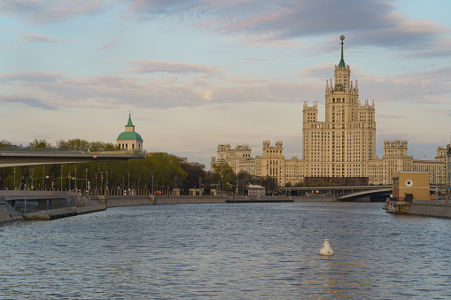 Photography of Stalinist skyscraper on Kotelnicheskaya embankment and Observation Deck Zaryadye Park in spring sunset. International touristic concepts during coronavirus pandemic time. No people.