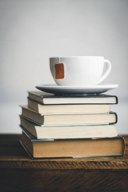 istock A cup of tea on a stack of books. Close-up. 1226633368