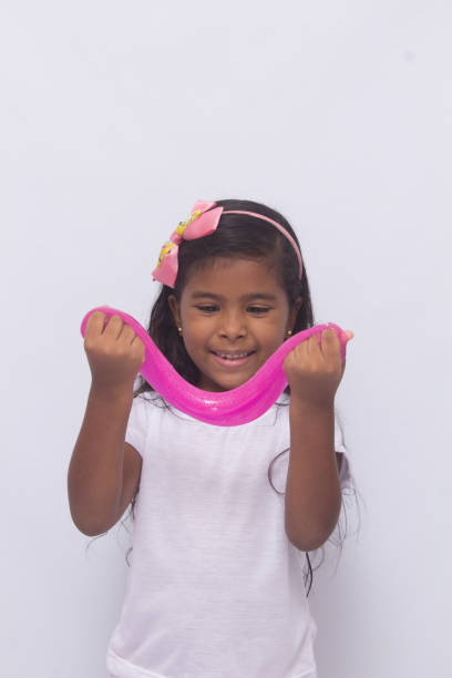 istock Funny girl holdin a glitter slime. 1226634439