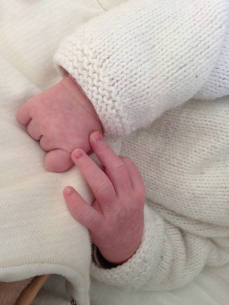 istock adorable baby little hands 1226637154