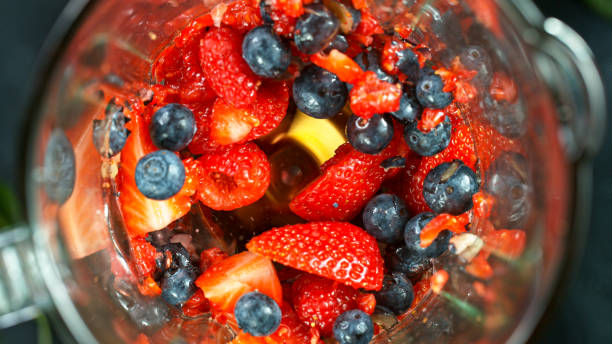 istock Berries fresh smoothie blended in blender, top view 1226643760