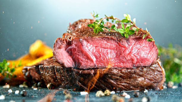 istock Close-up of tasty beef steak on black stone table 1226644332