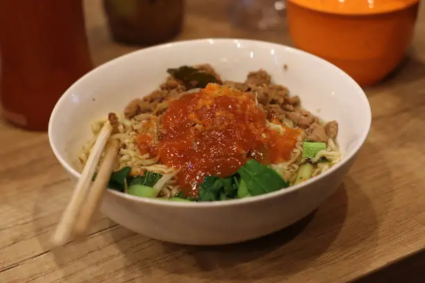 noodles served with chili sauce, vegetables and chicken, known as Mie ayam, the delicious indonesian food