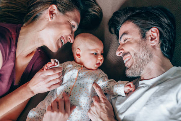 istock Lovely parents hugging their newborn baby. 1226644803