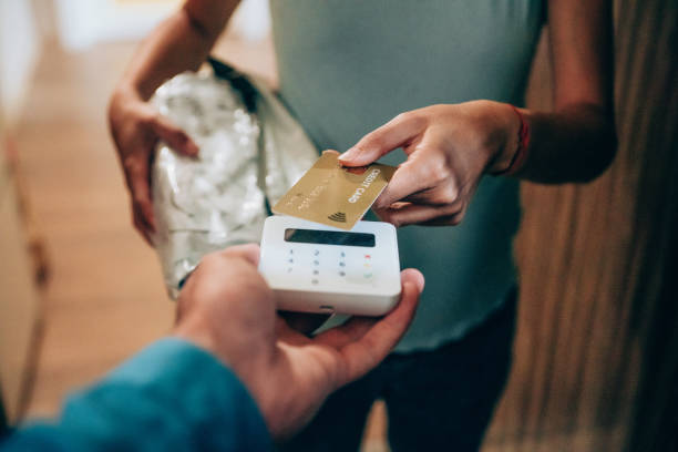 istock Woman paying contactless with credit card. 1226644814