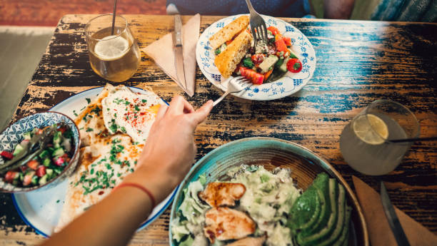 istock Young couple sharing tasty salad 1226644841