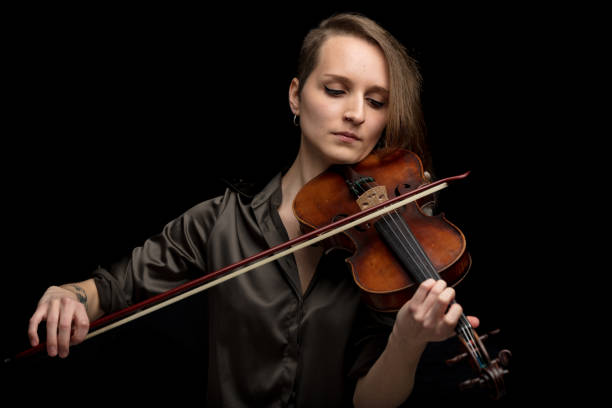 istock Professional female violinist playing in a concert 1226646367