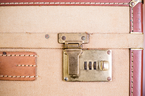 vintage trunk with locks  and wooden reinforcements stored in the room