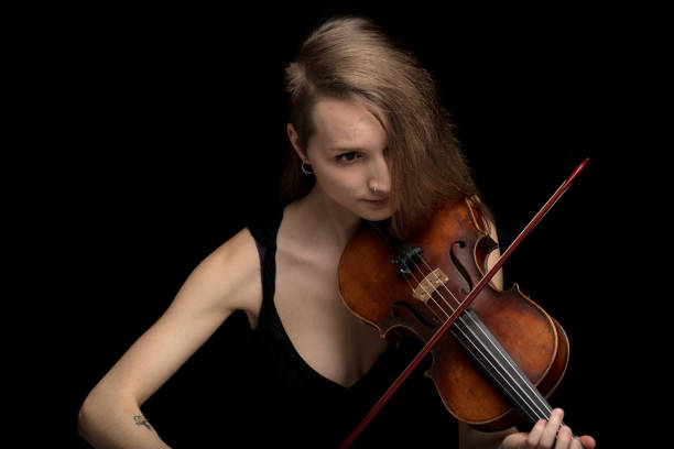 istock Passionate female musician playing baroque violin 1226647772