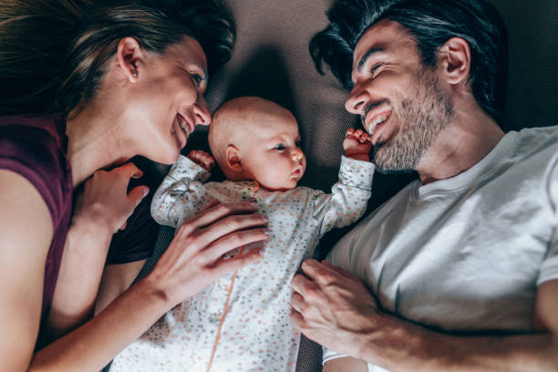 istock Lovely parents hugging their newborn baby. 1226652044