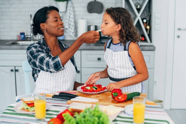 istock Mother and daughter in the kitchen 1226652086