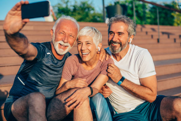 istock Cheerful mature friends taking selfie after working out 1226652370