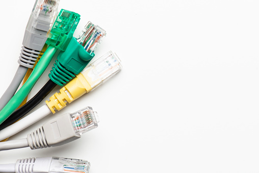 Network ethernet cables with RJ45 connectors on the white background.