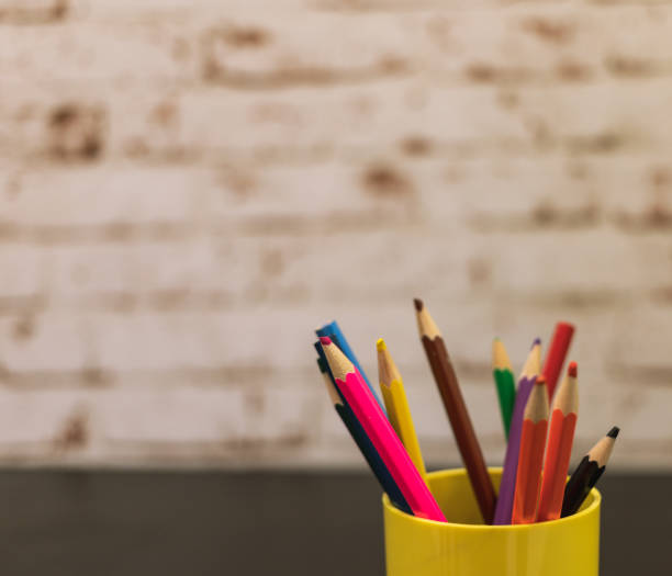 istock colored pencils in a cup on a black table against the background of a brick wall 1226653575