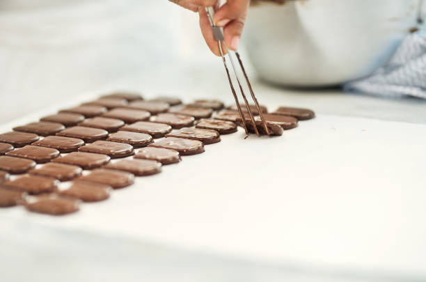 istock Baker making cookies at a commercial chocolate factory 1226654154