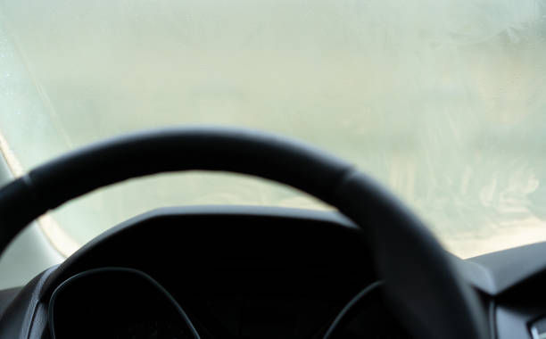 istock Steering wheel in car on glass background 1226654672