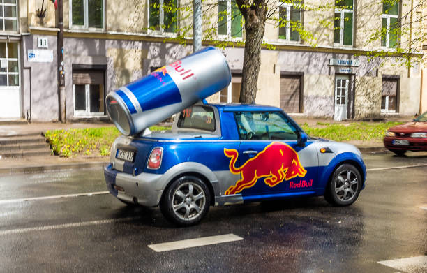 Sights of the Lithuanian capital April 27, 2018 Vilnius, Lithuania, Car Mini Cooper painted in the symbolism of the company Red Bull on one of the streets in Vilnius. red bull mini stock pictures, royalty-free photos & images