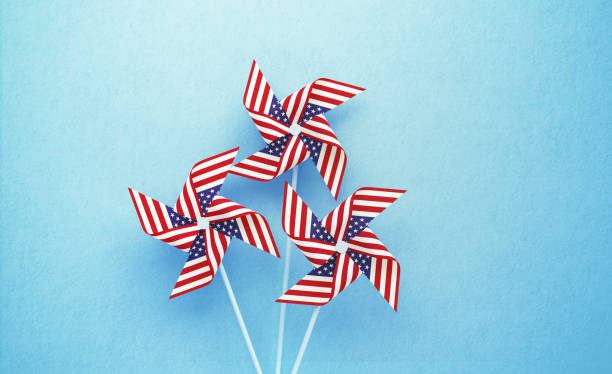 istock Paper Pinwheels Textured with American Flag on Dark Blue Background 1226657722