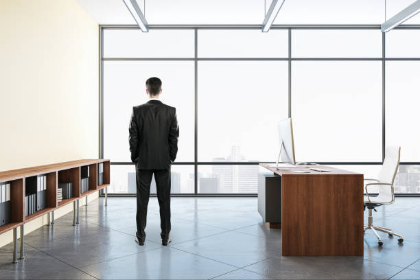 istock Businessman standing in modern coworking office 1226659505