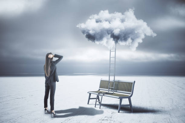 istock Businesswoman looking on ladder 1226659635