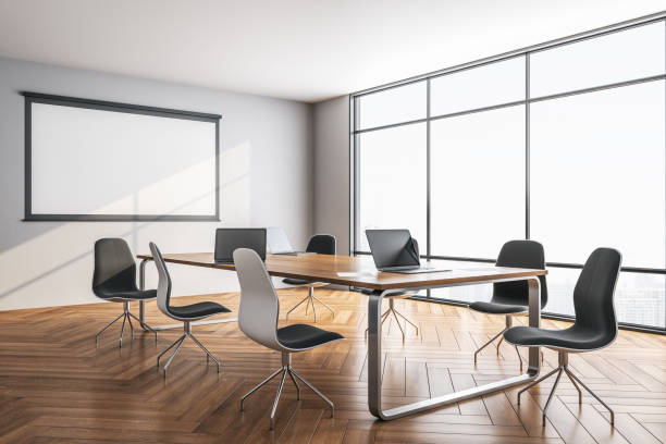 istock Meeting room interior with blank tv screen 1226660412