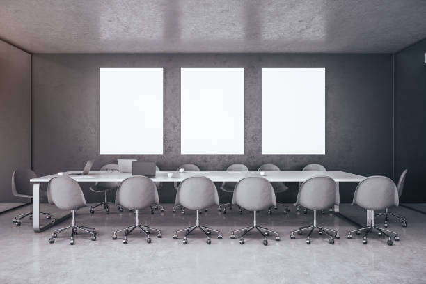 istock Modern conference interior with laptop and three blank poster 1226660415