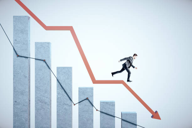 istock Businessman runs down on stock crash recession chart with red arrow. 1226660442