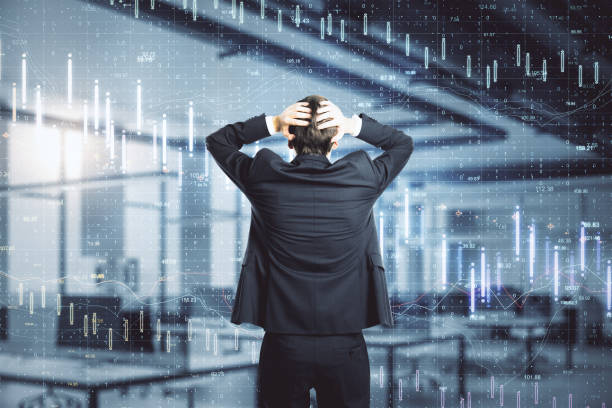 istock Scared businessman looking on creative crash recession chart hologram. 1226660487