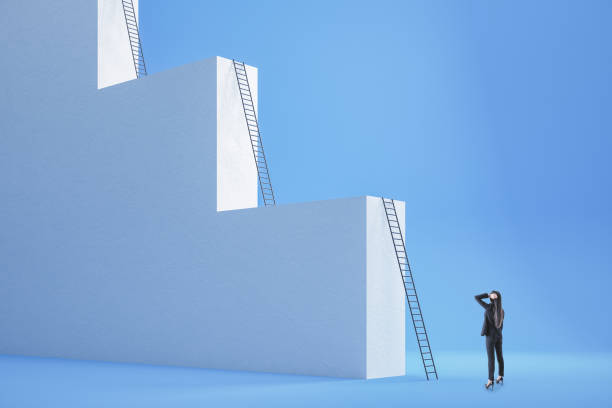 istock Businesswoman looking on ladder 1226660724