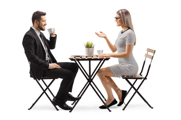 istock Young man and woman in a cafe talking and drinking coffee 1226661777