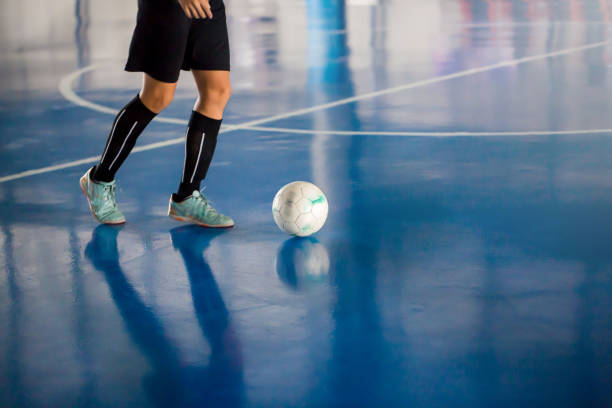 istock Blurry ball after futsal player control it to shoot to goal. 1226662862