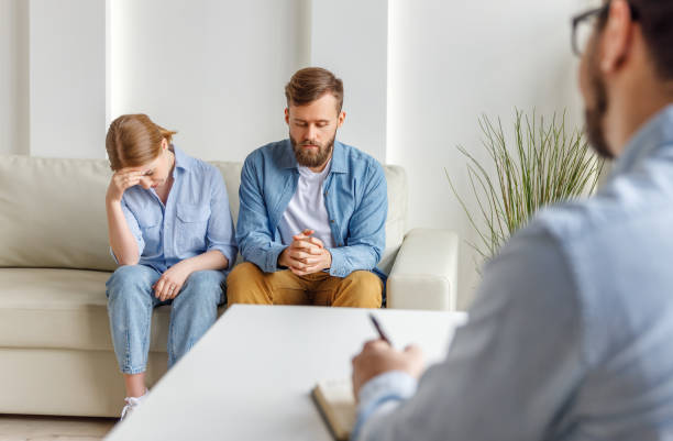 istock Couple visiting psychologist in modern clinic 1226663800