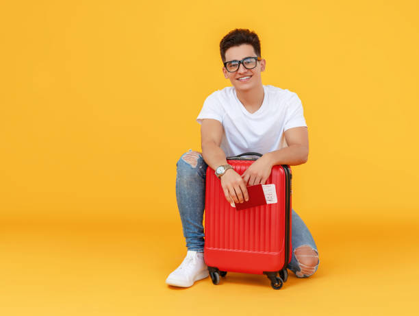 istock Cheerful male traveler with suitcase 1226663891
