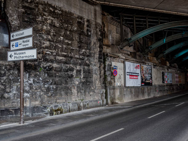 Bogota, Colombia - April 11, 2020: This is the Southbound carriageway of the usually busy Carrera 9 or 9th Avenue, as it passes through the underpass on Calle 100 in the Colombian Capital city of Bogota. The section normally has heavy vehicular traffic at this time of the day. Today it is deserted due to the declared Coronavirus lockdown by the Government in the Country. Only people with valid reasons are allowed to step outside. Also seen are two bridges linked to the traffic management system. The altitude at street level is about 8500 feet above mean sea level. Driver's Point of View. Horizontal Format.