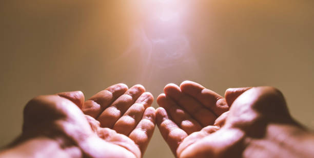 istock Muslim man praying. Ramadan kareem concept: Muslim prayer open two empty hands up on light background 1226664551