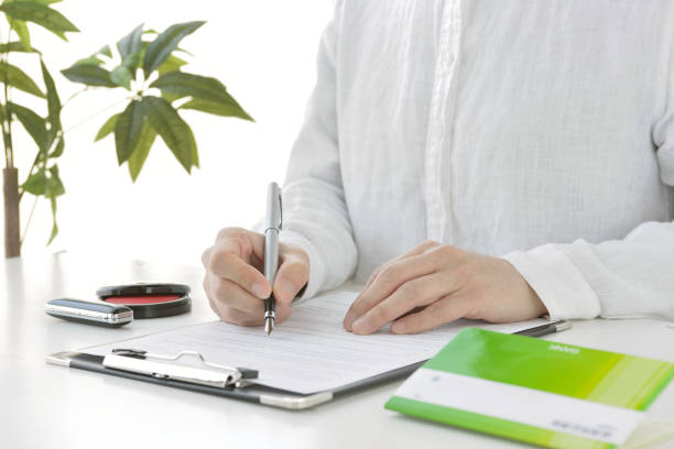 istock Japanese woman signing contract 1226673304
