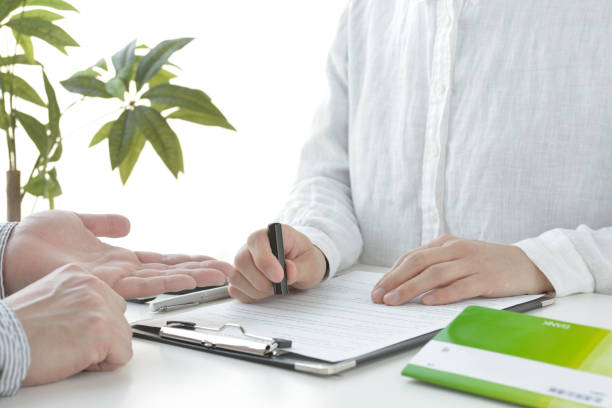 istock Japanese woman signing contract 1226673306