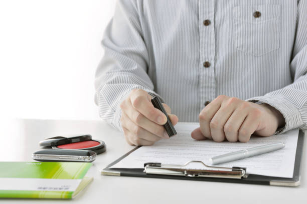 istock Japanese man signing contract 1226673307
