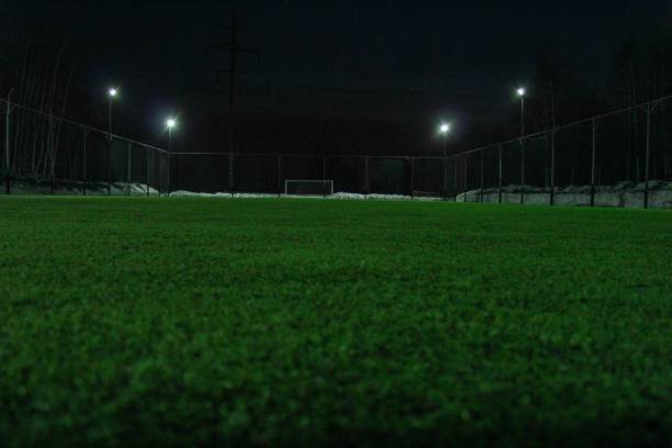 istock Lighted Empty Soccer Field In The Night 1226673388