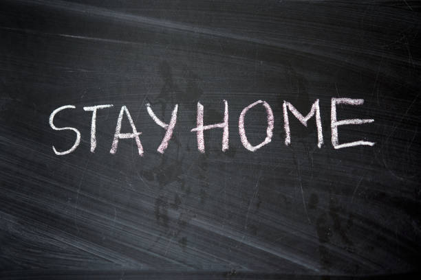 istock Hashtag stay at home. Outbreak Warning. written white chalk on blackboard in connection with epidemic of coronavirus worldwide. 1226673484